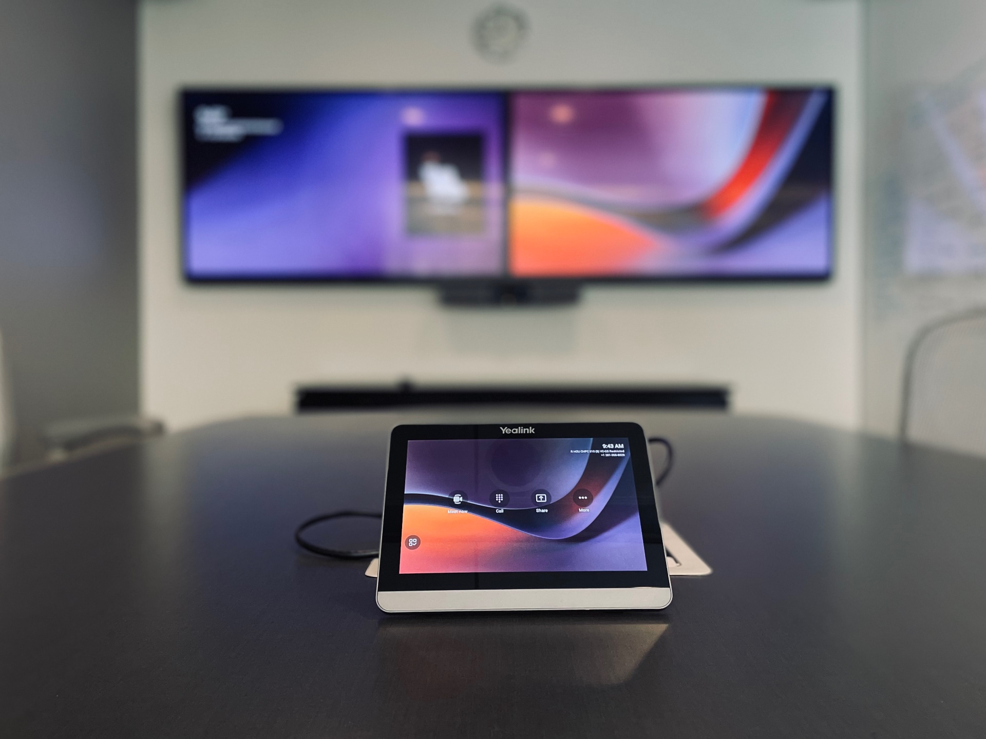 Conference room dual-display setup with Yealink touch controller and soundbar