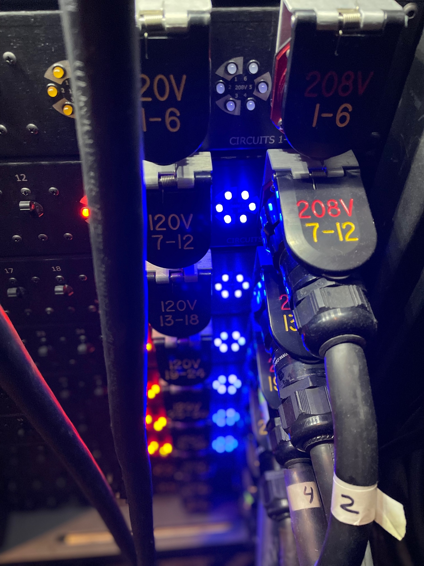 Labeled 120V and 208V power distribution feeding stage and lighting circuits